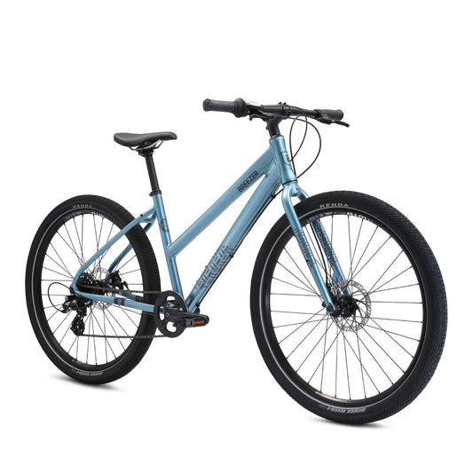 Breezer Midtown step-through commuter bicycle – A light blue step-through aluminum commuter bicycle with black Kenda tires, disc brakes, and a black saddle, shown from a three-quarter angle against a white background.