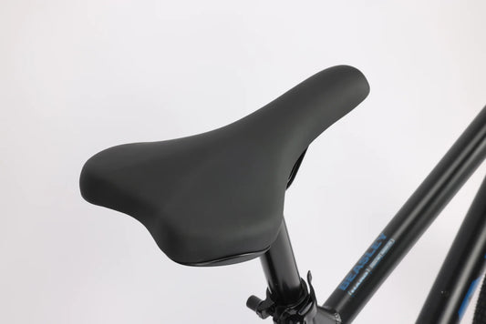 Black padded bicycle saddle and seatpost – A close-up view shows a smooth black padded bike saddle mounted on a black metal seatpost against a plain white studio background.