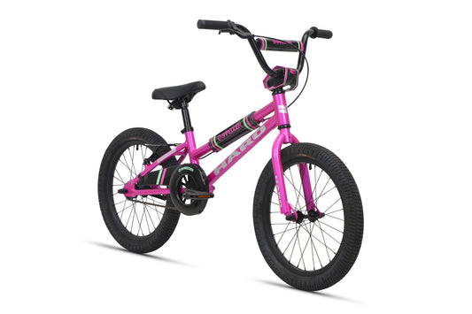 Magenta Haro Shredder kids BMX bike – Bright magenta step-through kids BMX bike with black tires, a low-slung frame, handlebar crossbar pads, and a chain guard over a pure white studio background.