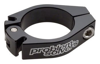 Black Problem Solvers dual cable backstop clamp – A circular black aluminum cable backstop clamp with dual cable slots, a silver hinge pin, bolt fastener, and printed brand logo over a white background.