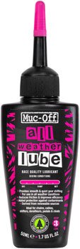 Muc-Off All Weather Lube 50ml bottle – Black squeeze bottle of Muc-Off All Weather Lube standing upright with a pink applicator tip, black screw cap, and pink-accented label over a plain white background.