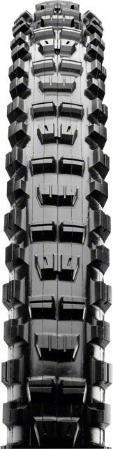 Maxxis Minion DHR II black tire tread – Straight-on view of black rubber mountain bike tire tread featuring aggressive paddle-shaped center knobs and chunky cornering side lugs against a white background.