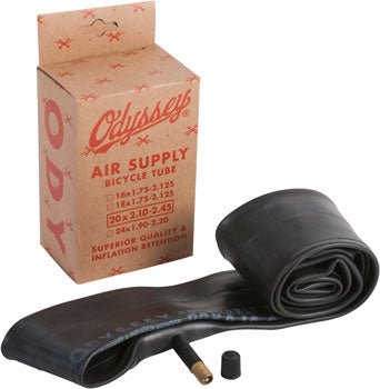 Odyssey Air Supply bicycle tube with box – A rolled black rubber bicycle inner tube with a Schrader valve rests next to its brown cardboard retail packaging against a plain white background.