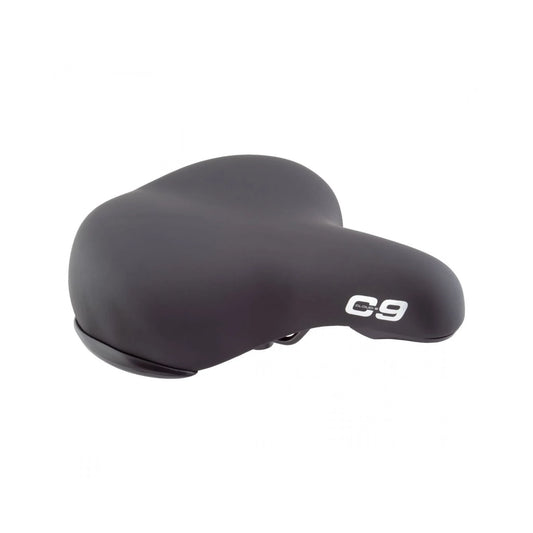 Cloud-9 black XL cruiser bike saddle – A wide, padded black cruiser bicycle saddle with a white C9 logo on the nose is shown in a three-quarter perspective over a solid white background.