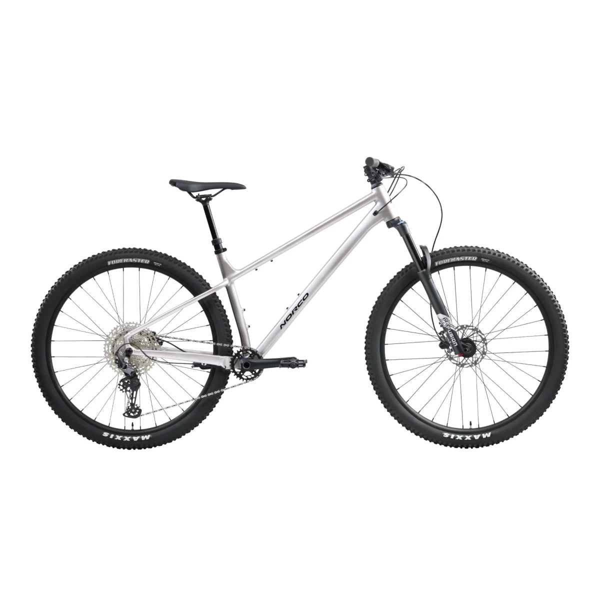 Norco Charger 2 hardtail trail mountain bike – A silver Norco Charger 2 hardtail trail mountain bike displayed in profile against a white background, featuring knobby Maxxis tires, a front suspension fork, and a black saddle.