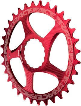 RaceFace red direct mount chainring – A red anodized aluminum direct-mount chainring with narrow-wide teeth, textured five-spoke cutouts, and white RaceFace branding centered against a plain white background.