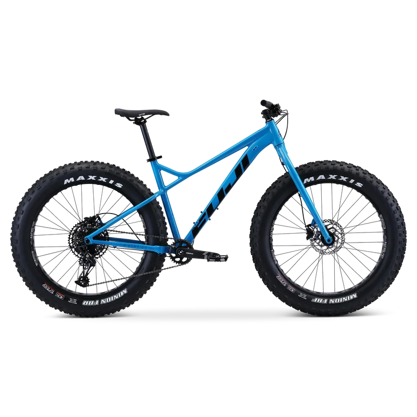 Fuji Wendigo 1.1 blue fat bike – A bright blue Fuji Wendigo fat bike shown in side profile, featuring oversized black Maxxis tires, a rigid fork, disc brakes, and black branding against a plain white background.