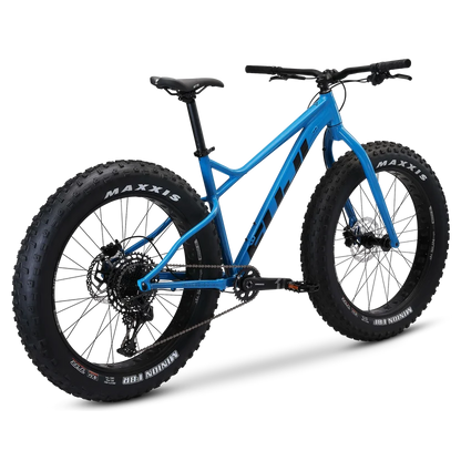 Fuji Wendigo 1.1 blue fat bike – A bright blue all-terrain fat bike with oversized knobby Maxxis tires, black disc brakes, and a rigid front fork, shown from a rear three-quarter studio view against a white background.