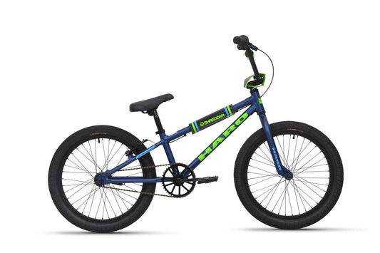Haro Shredder 20 kids BMX bike in blue – A kids BMX bicycle featuring a deep blue frame with bright green Haro branding, black 20-inch wheels, protective top tube padding, and high-rise handlebars against a plain white background.