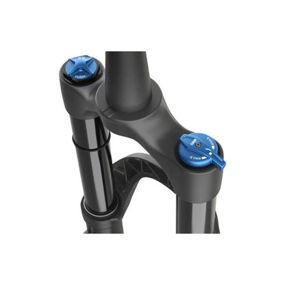 FOX 38 Performance suspension fork crown – Close-up of a matte black bicycle suspension fork crown, showing black stanchions, blue anodized GRIP adjustment dial, and air top cap against a white background.