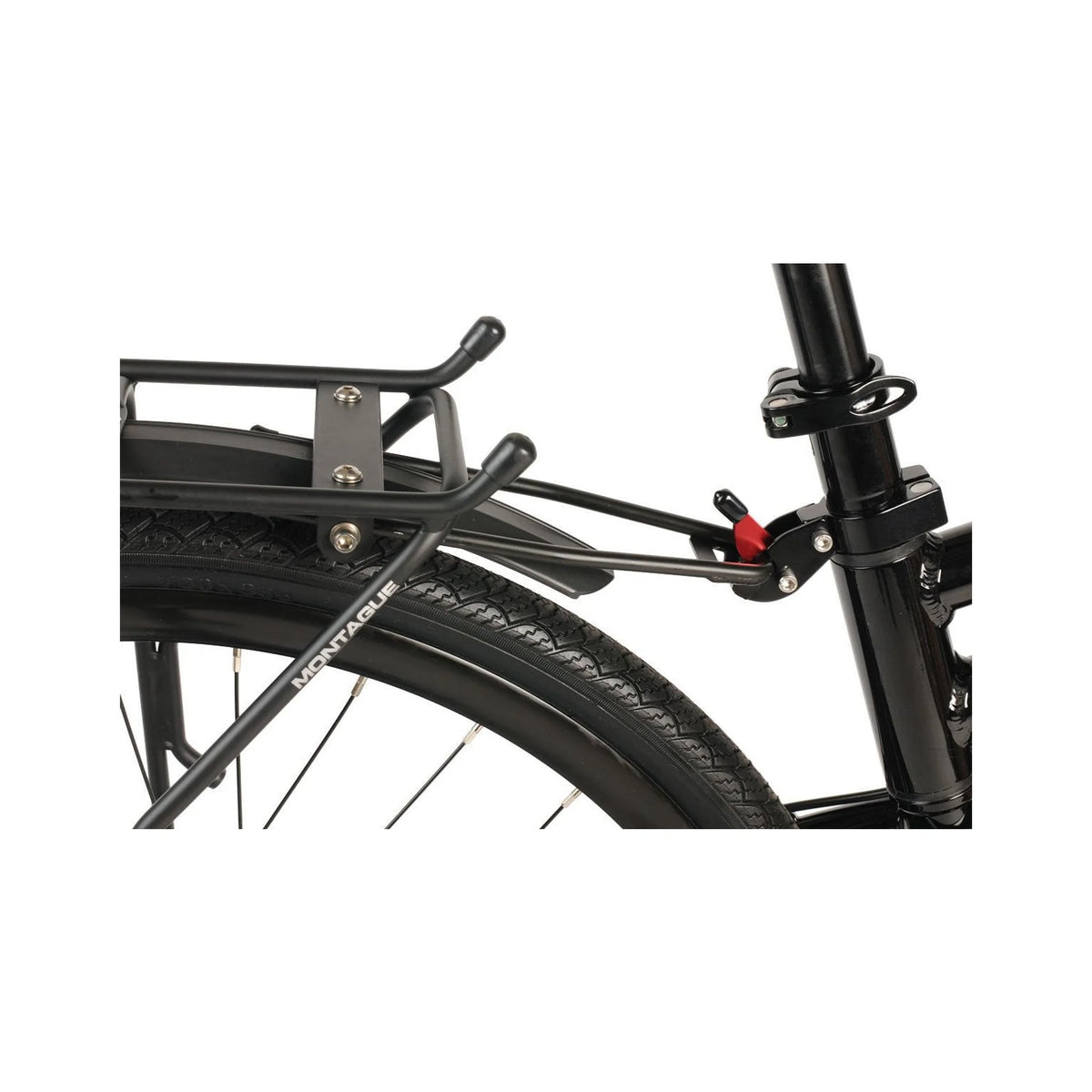 Montague folding bike rear cargo rack – Close-up of a matte black Montague rear cargo rack and fender mounted above the back tire, clamped to the seatpost with a red quick-release lever.