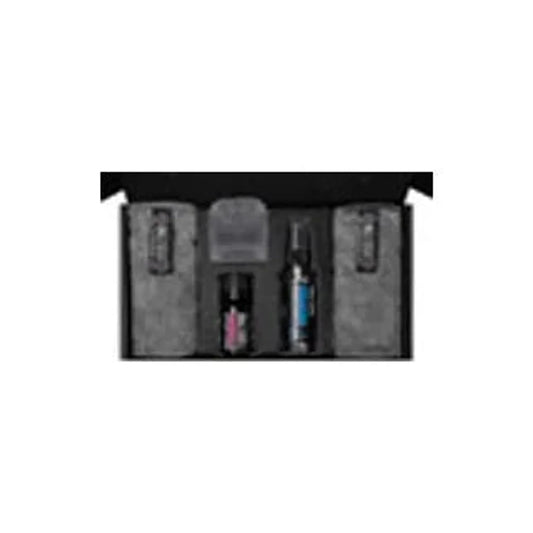 Muc-Off ceramic protection coating kit – An open black presentation box containing two bottles of ceramic coating solution, microfiber cloths, and an applicator block neatly organized in molded inserts.