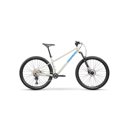 Norco Charger 2 hardtail mountain bike – Profile view of an off-white hardtail mountain bike featuring black Maxxis knobby tires, front suspension forks, disc brakes, and blue Norco lettering against a plain white studio background.