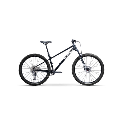 Norco Charger 2 hardtail mountain bike – A dark metallic blue Norco hardtail mountain bike is displayed in a side profile studio shot with knobby Maxxis tires, front suspension, and a black saddle.