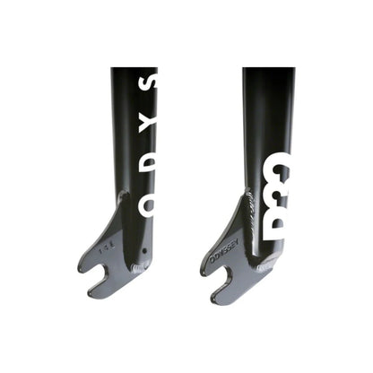 Black Odyssey R32 BMX fork dropouts – A close-up view of glossy black steel BMX fork dropouts features welded seams, slotted axle holes, embossed Odyssey branding, and bold white graphics on a plain background.