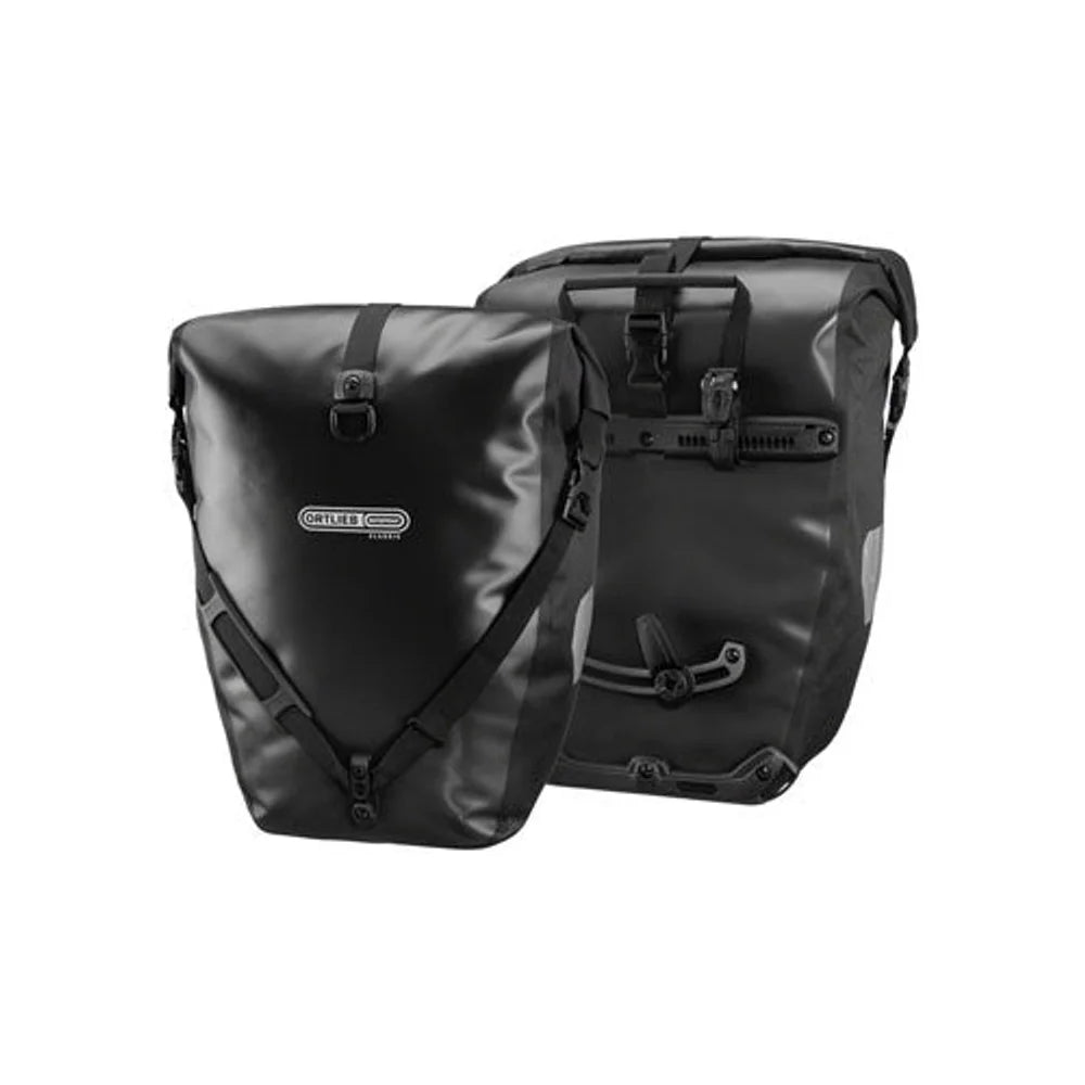 Black Ortlieb waterproof bicycle pannier pair – A pair of black waterproof bike panniers displayed against a white background, showcasing the front roll-top closure with buckles on one and the rack mounting system on the other.