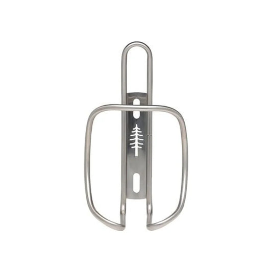 PDW ZigZag silver bike water bottle cage – Front view of a matte silver metal bicycle bottle cage featuring a cutout pine tree silhouette on its mounting bracket against a solid white background.