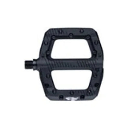 Black composite RaceFace Chester platform pedal – A top-down view of a single black composite flat bike pedal featuring traction pins, textured tread lines, and an axle spindle against a white background.