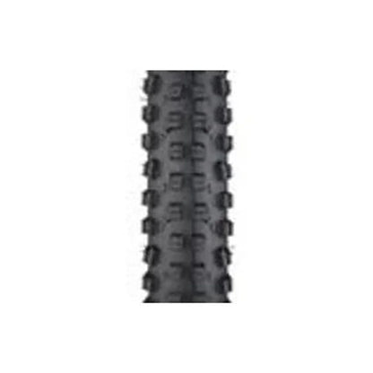 Surly Dirt Wizard knobby bike tire tread – A close-up view of the aggressive black rubber tread pattern on a mountain bike tire, featuring prominent raised center and side knobs against a plain white background.
