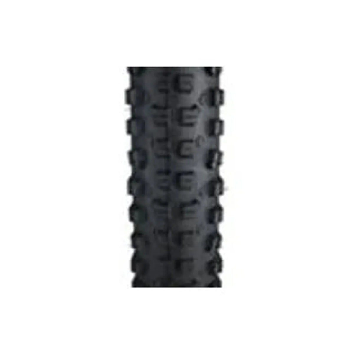 Surly Dirt Wizard knobby bike tire tread – A close-up view shows the aggressive black rubber tread pattern and deep side knobs of a mountain bike tire centered against a white background.